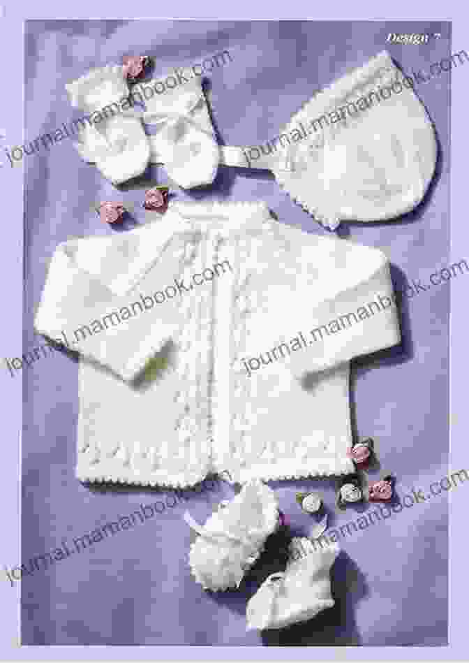 A Baby Wearing A Knitted Matinee Jacket And Hat Set In Blue And White. Knitting Pattern KP60 Baby Matinee Jacket And Hat Set 0 3 3 6mths USA Terminology #60