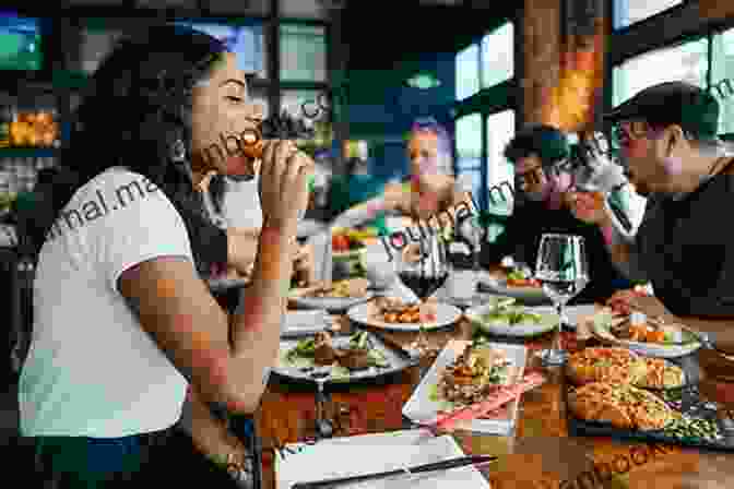 Photo Of A Group Of People Eating At A Local Restaurant The Top 20 Amazing In Depth Travel Hacks For The Budget Traveler 2024: Everyone Can Travel The World With These Hacks